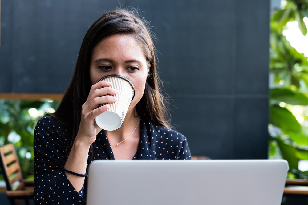 woman taking paid survey on laptop